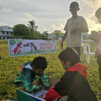 kids looking for toys in a box