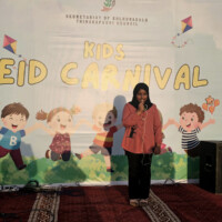 young little girl singing on a kids carnival stage