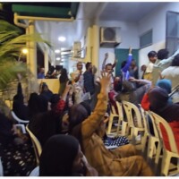 raising hands to show vote